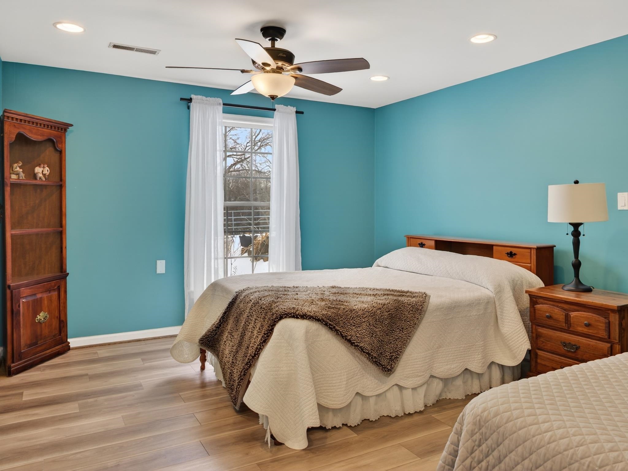 235 Howardsville Road Staunton, VA 24401 - Photo 39 of 51 a bedroom with a bed and a chandelier