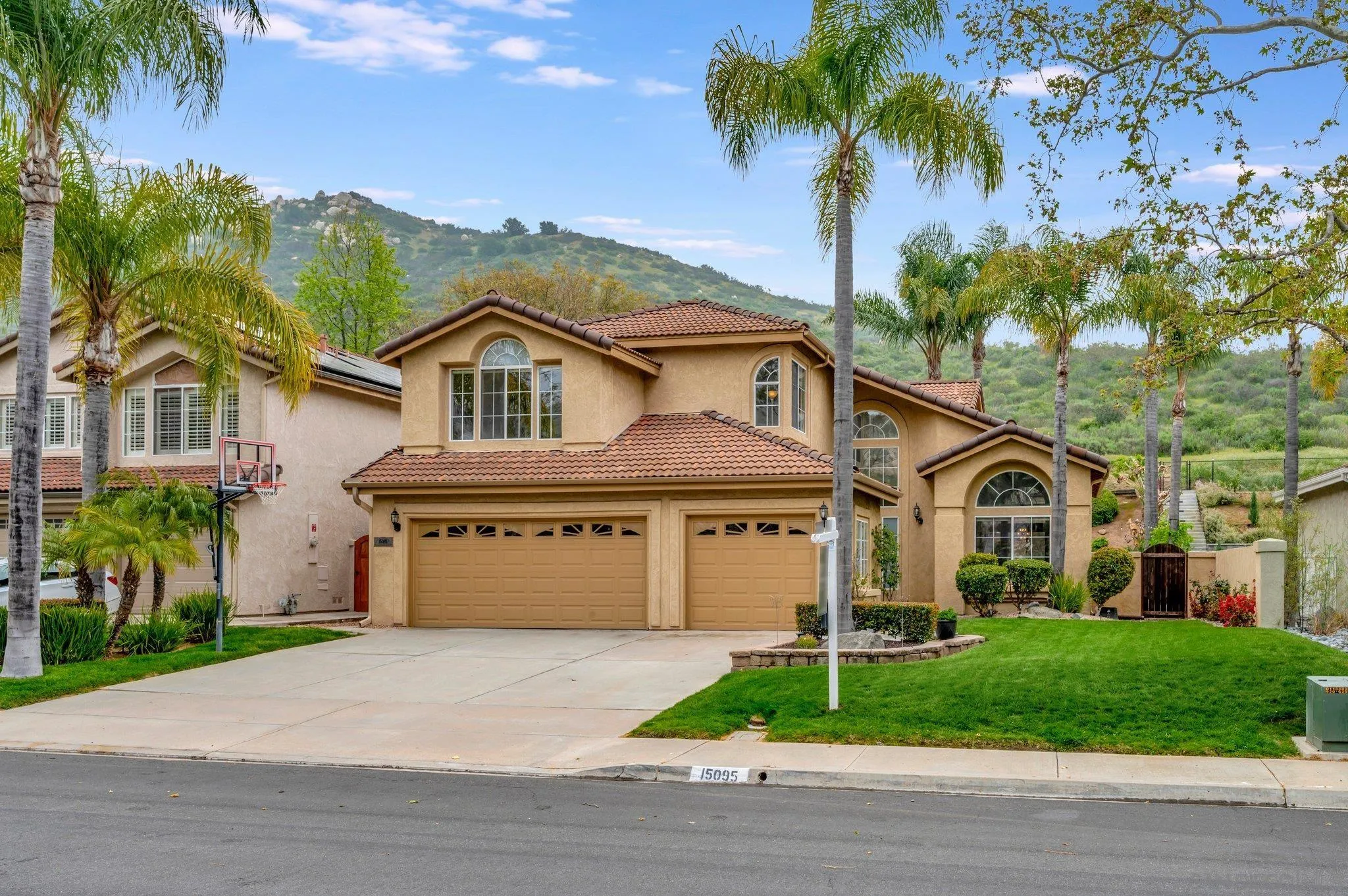 front view of a house with a garden