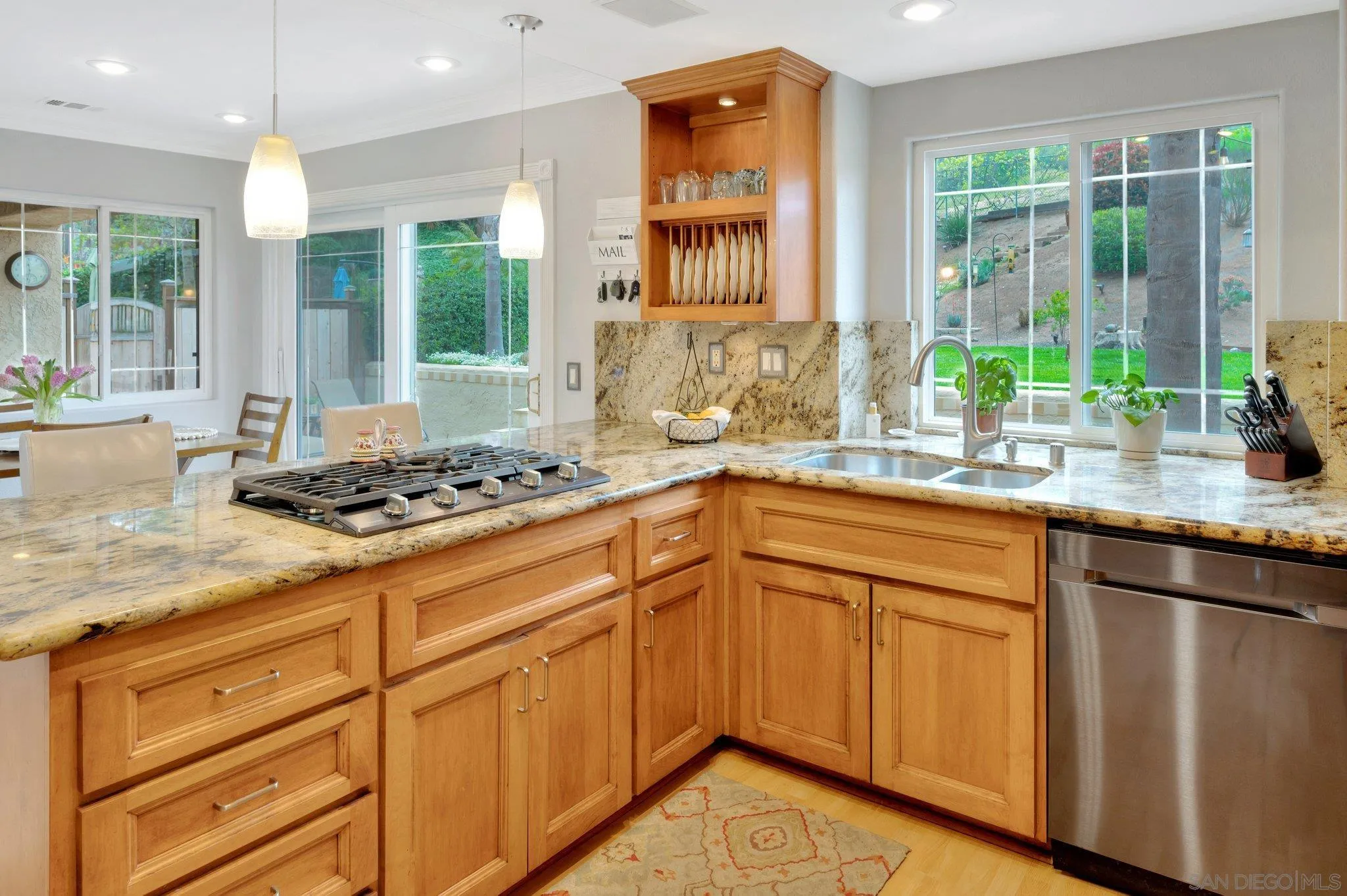 15095 Garden Road Poway, CA 92064 - Photo 13 of 55 a kitchen with stainless steel appliances granite countertop a sink stove and cabinets