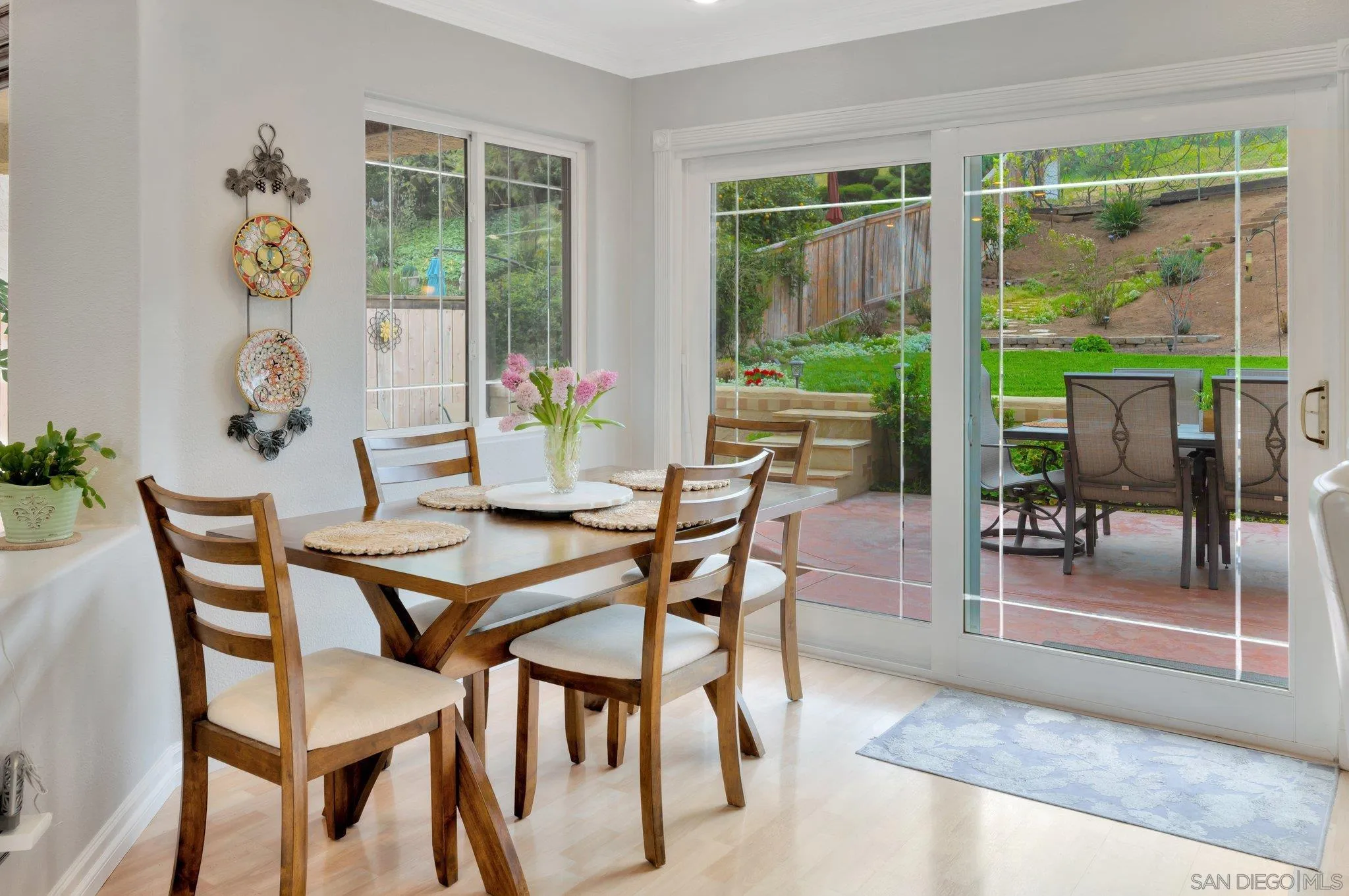 15095 Garden Road Poway, CA 92064 - Photo 14 of 55 a dining room with furniture and a floor to ceiling window