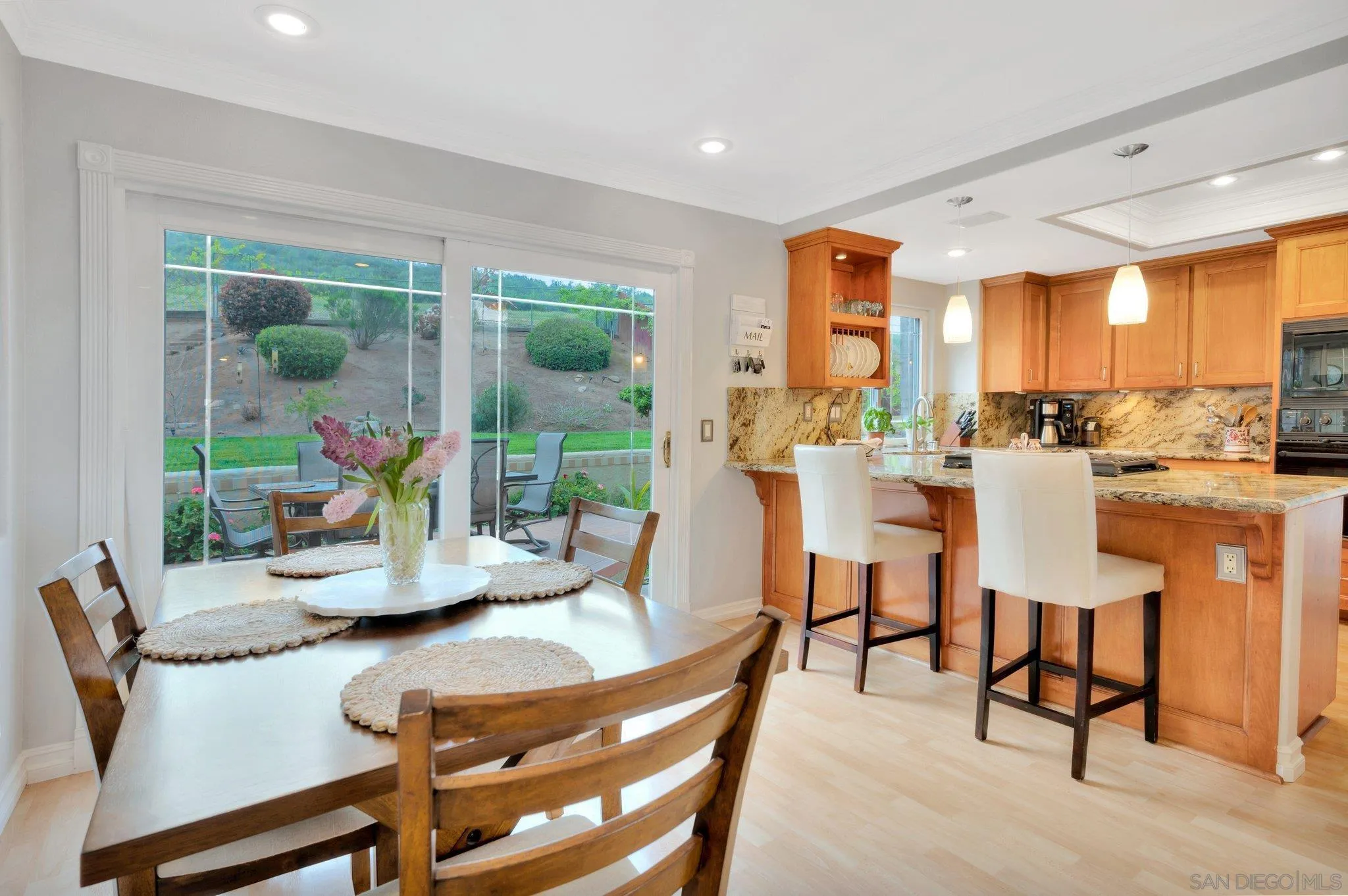 15095 Garden Road Poway, CA 92064 - Photo 15 of 55 a dining room with furniture water view and a floor to ceiling window