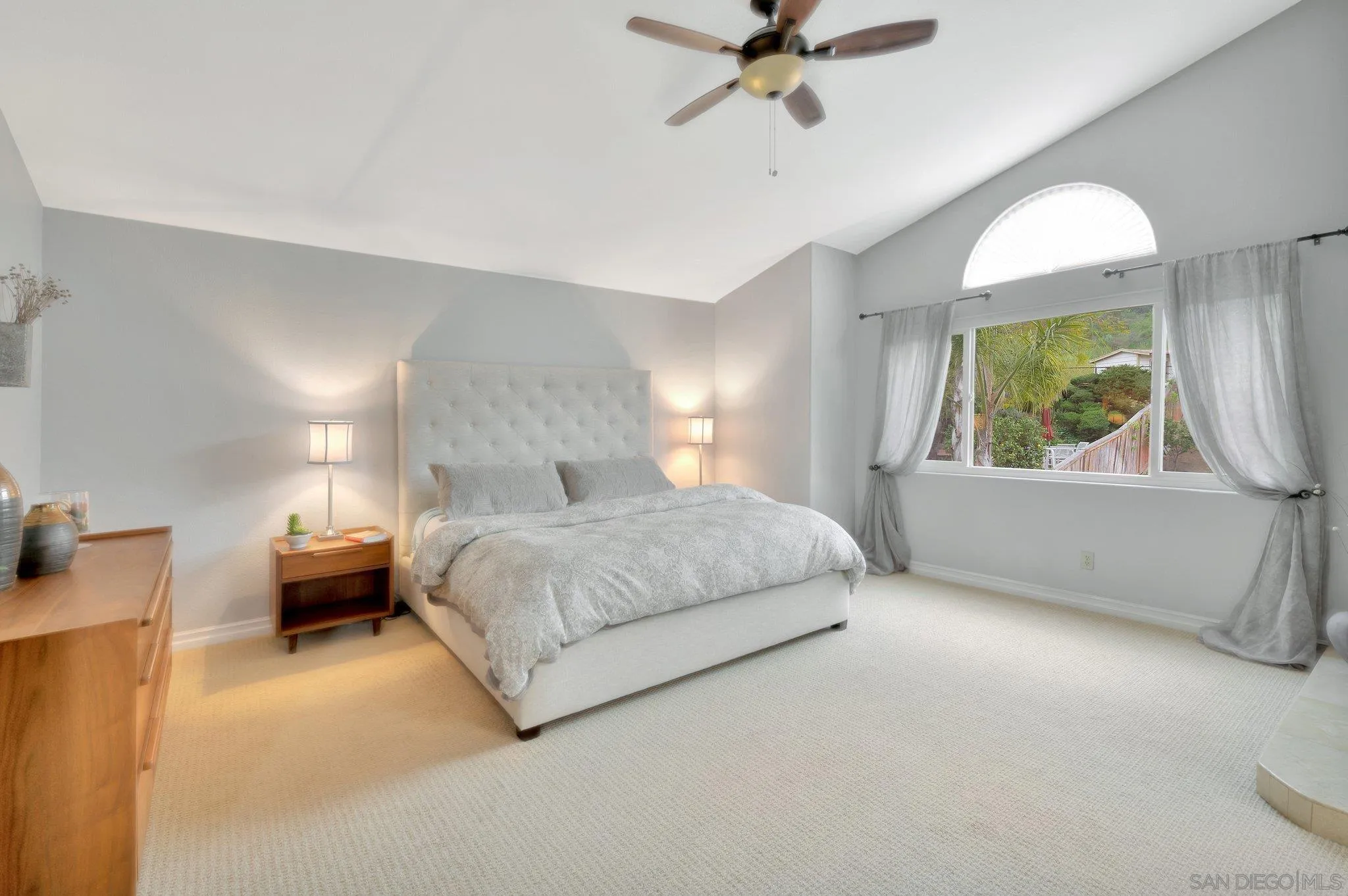15095 Garden Road Poway, CA 92064 - Photo 22 of 55 a bedroom with a bed and a chandelier