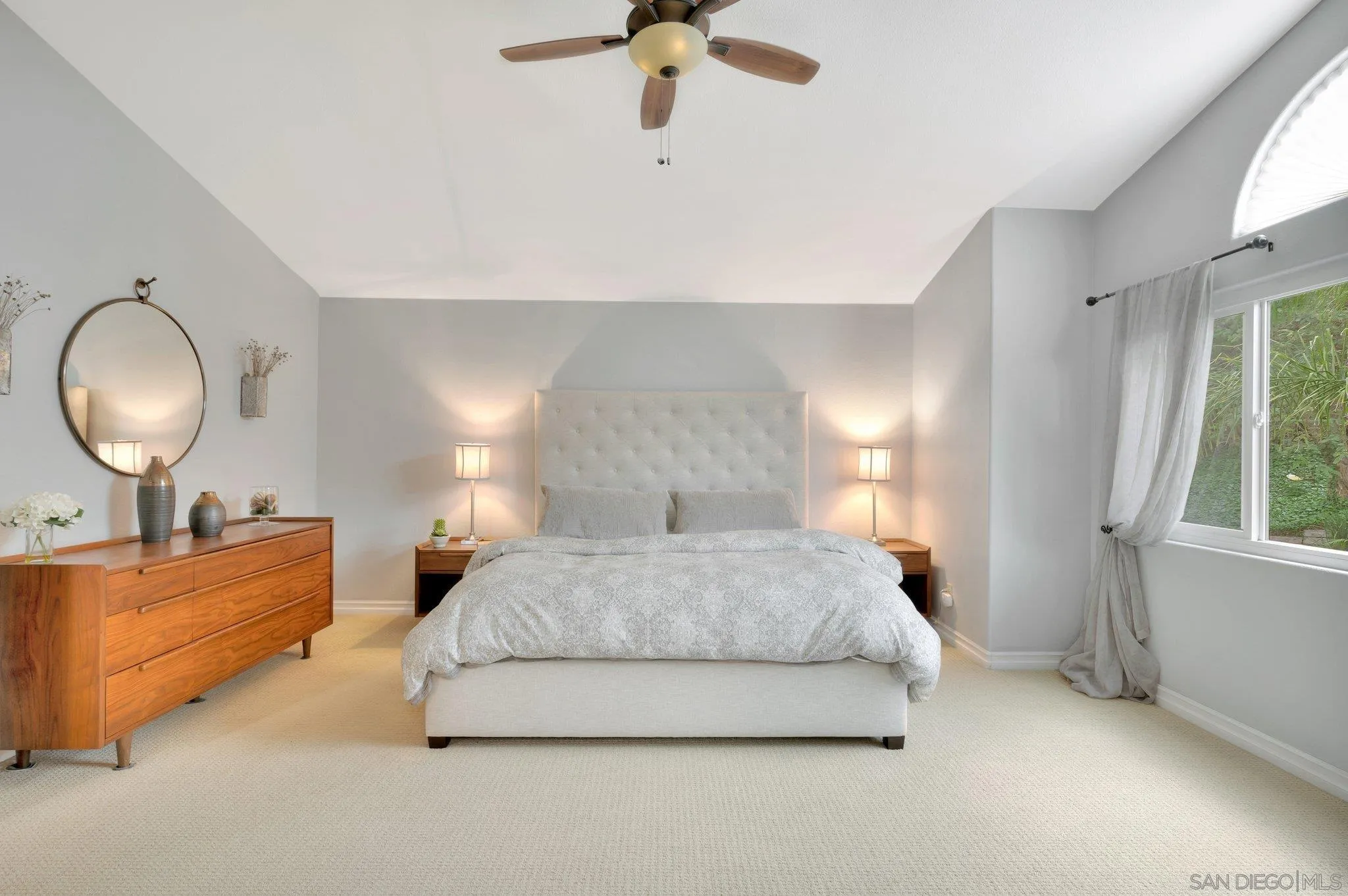 15095 Garden Road Poway, CA 92064 - Photo 23 of 55 a spacious bedroom with a bed lamp and window
