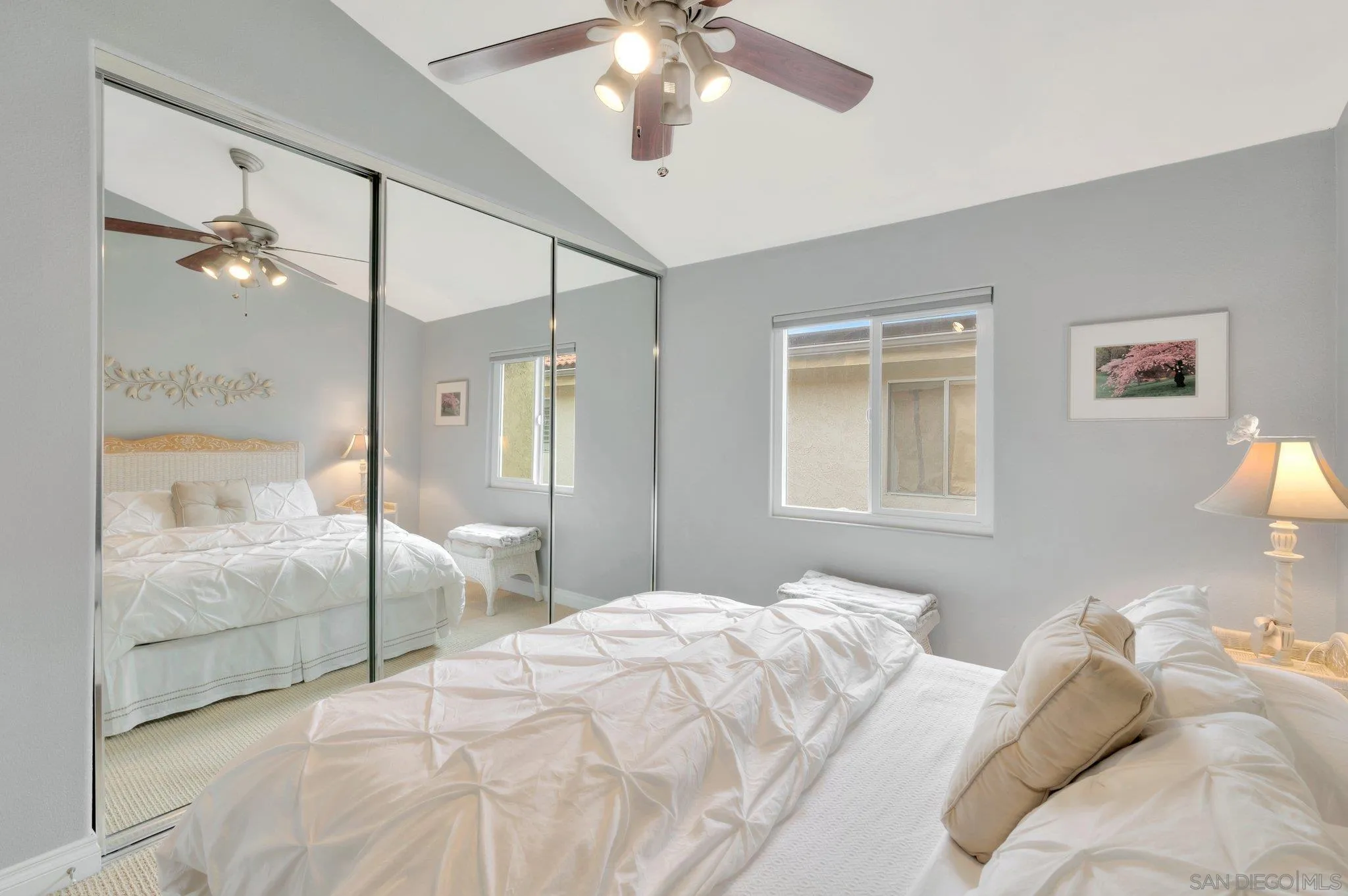 15095 Garden Road Poway, CA 92064 - Photo 27 of 55 a bedroom with a large bed and a chandelier