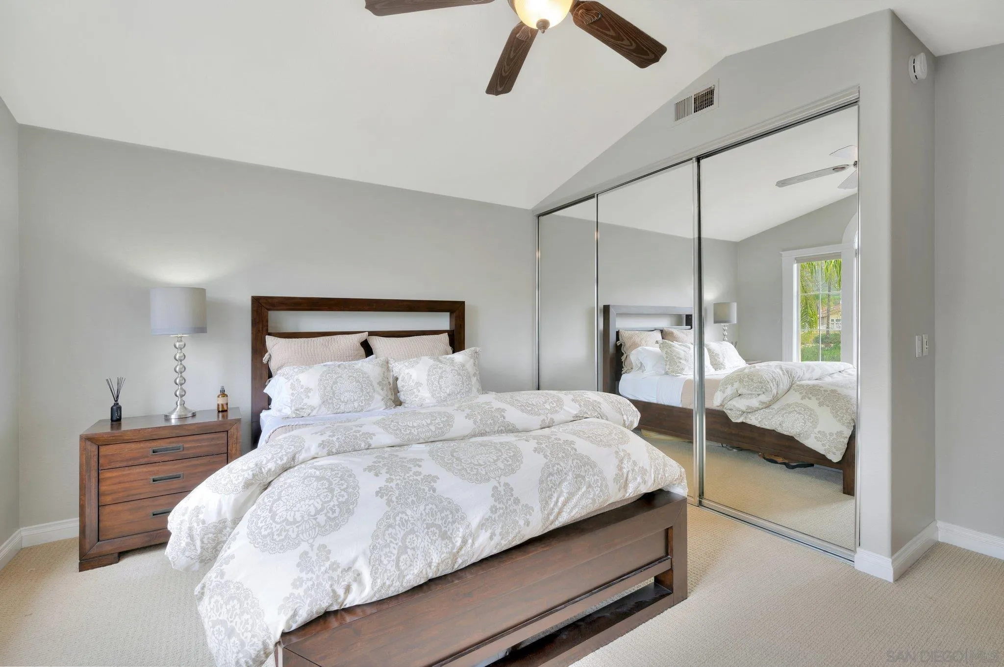 15095 Garden Road Poway, CA 92064 - Photo 30 of 55 a bedroom with a bed and window