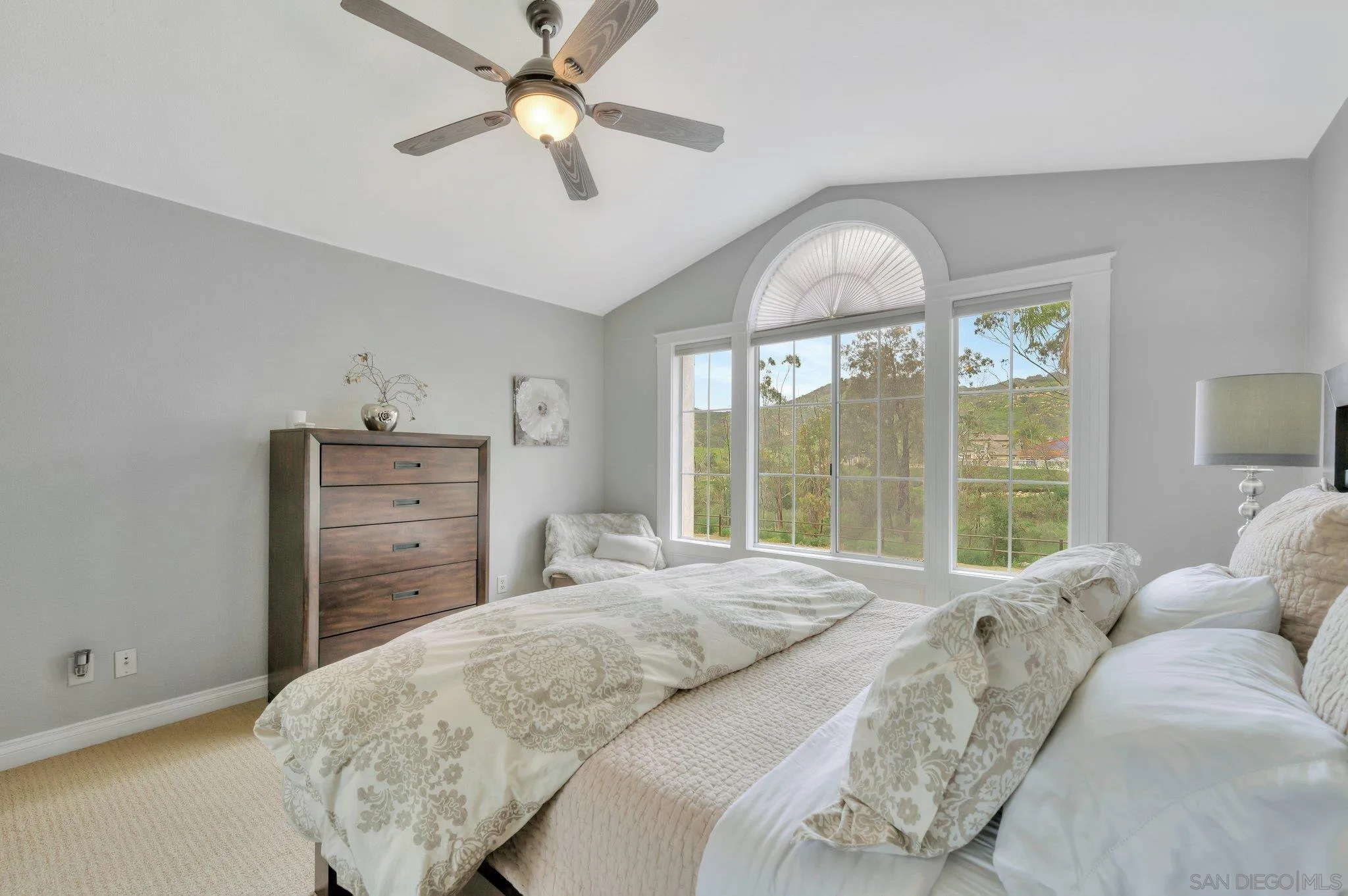 15095 Garden Road Poway, CA 92064 - Photo 31 of 55 a bedroom with a bed dresser and a window