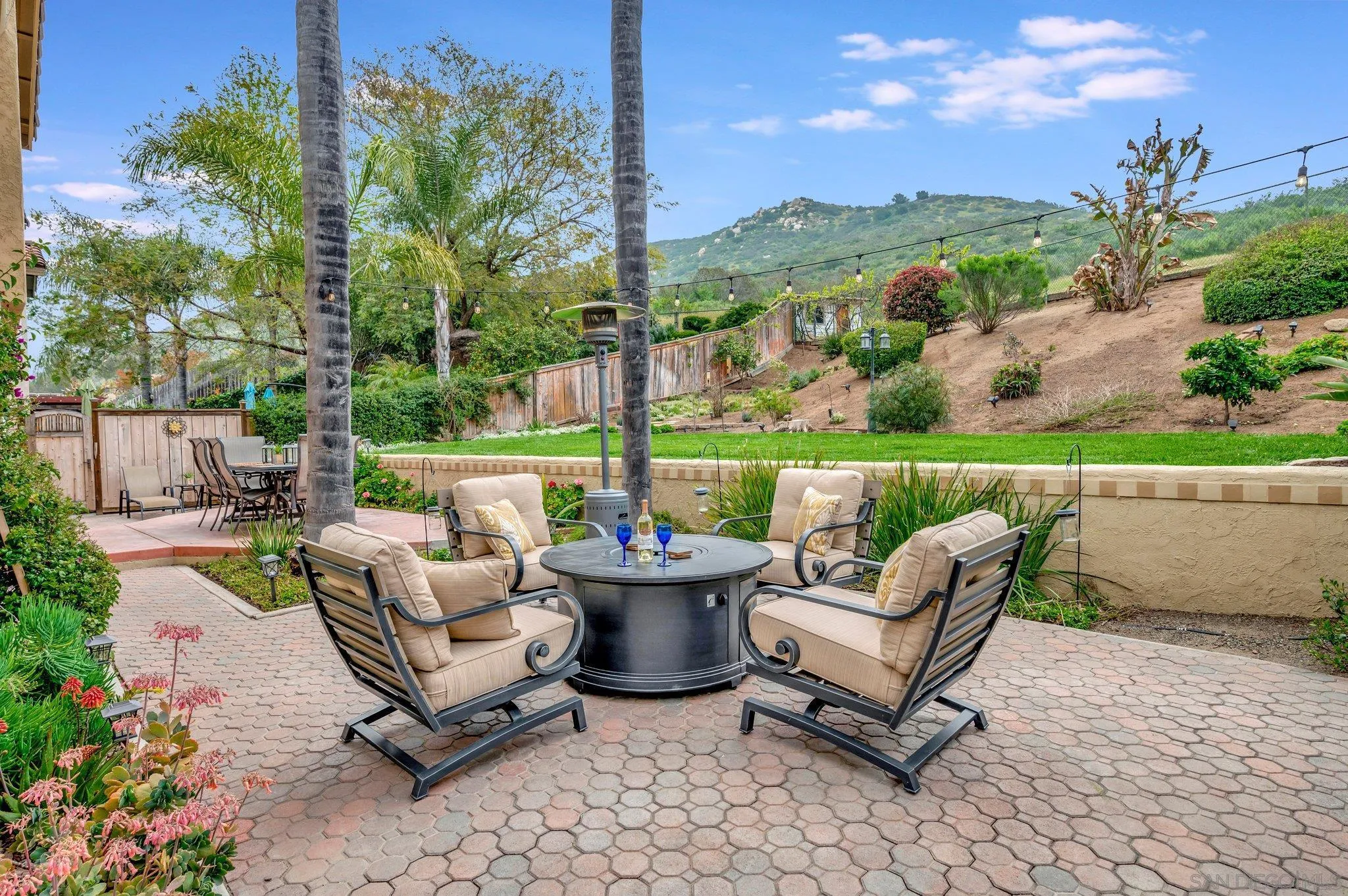 15095 Garden Road Poway, CA 92064 - Photo 37 of 55 a view of a patio with furniture and a garden