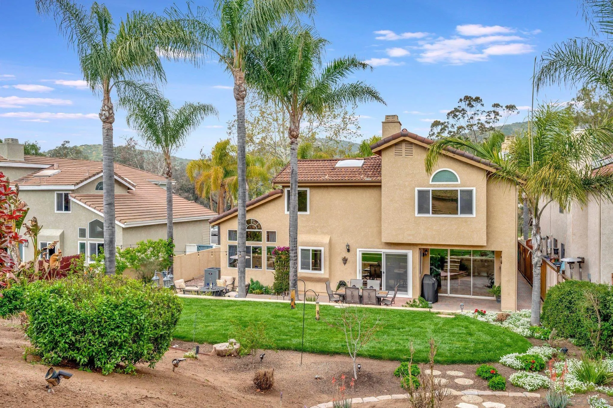 15095 Garden Road Poway, CA 92064 - Photo 40 of 55 a view of a house with a yard and potted plants