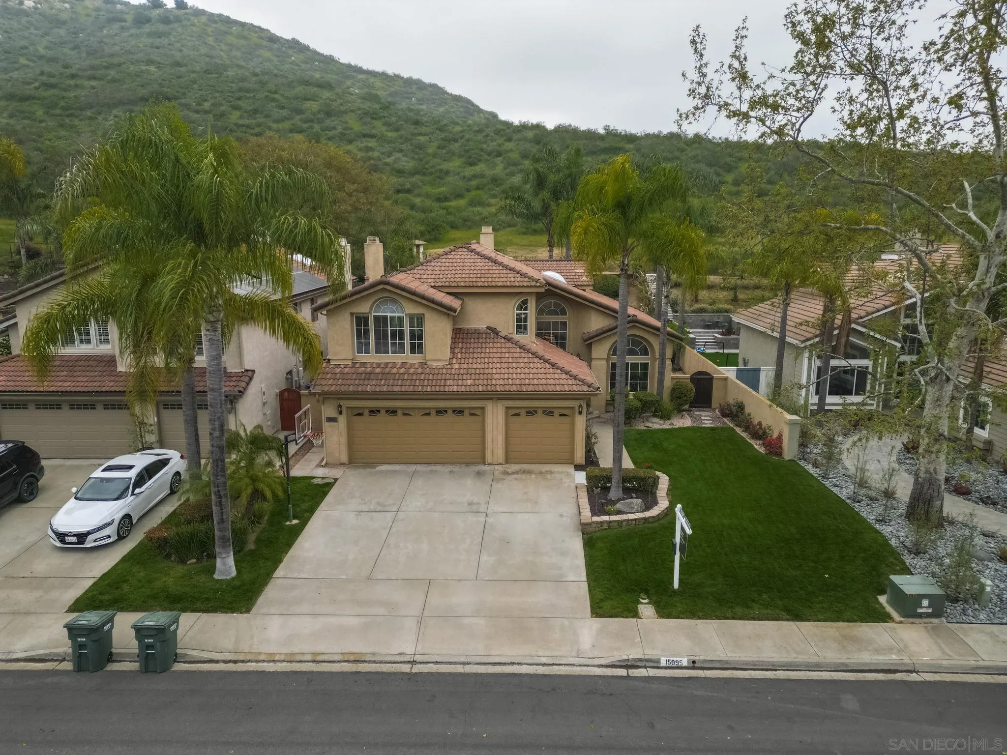 15095 Garden Road Poway, CA 92064 - Photo 43 of 55 a front view of a house with garden