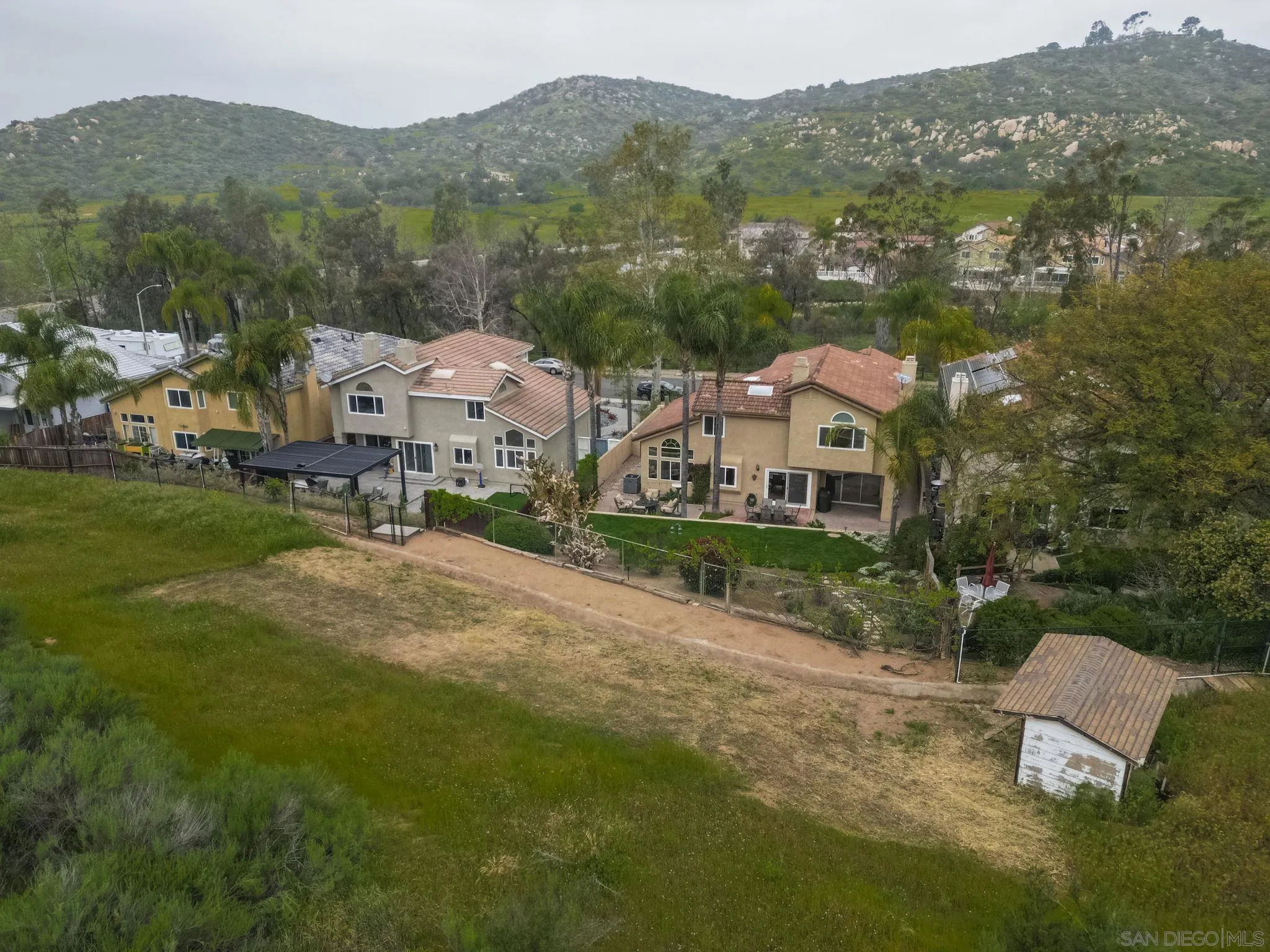 15095 Garden Road Poway, CA 92064 - Photo 54 of 55 an aerial view of residential houses with outdoor space and trees