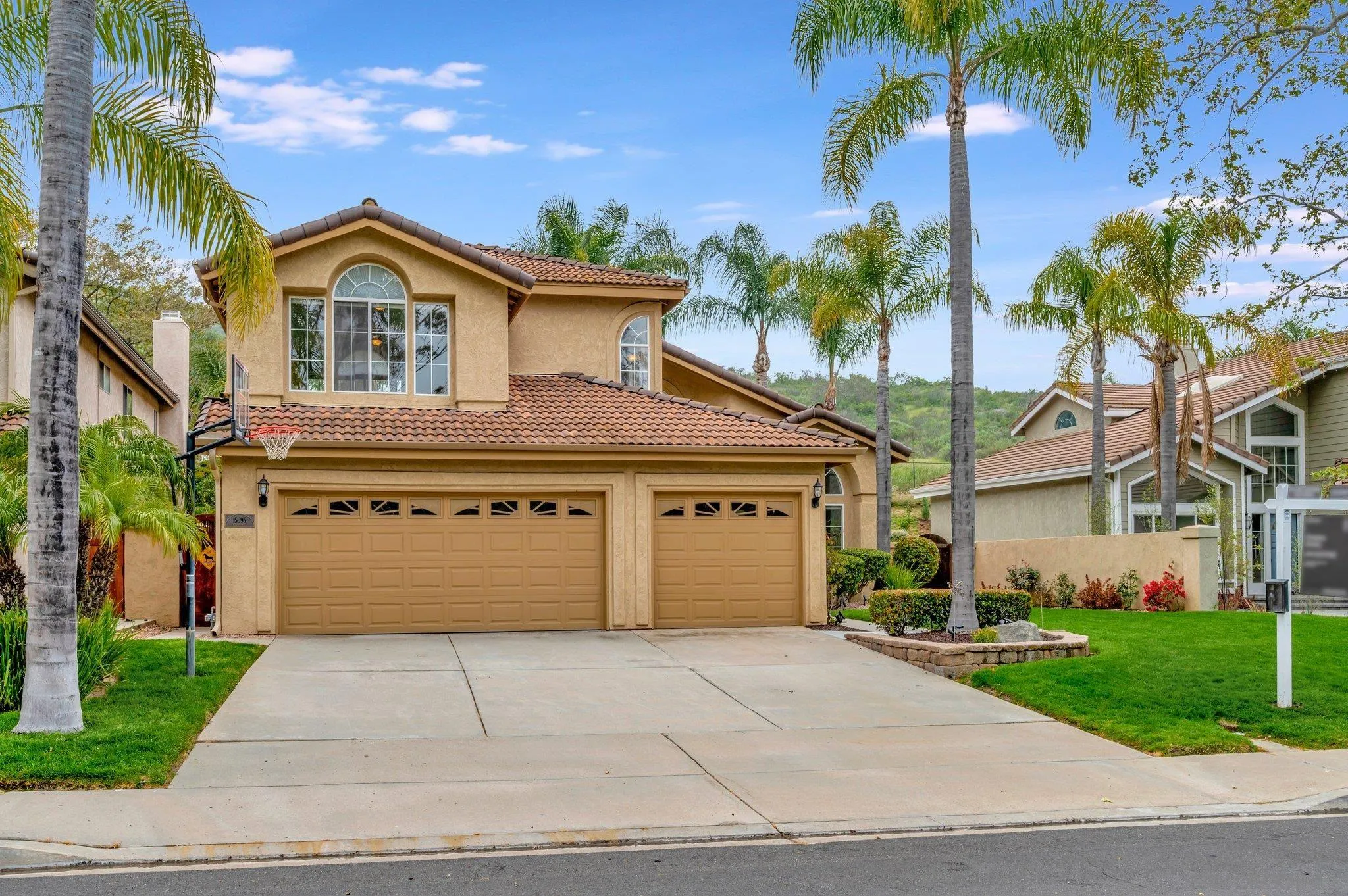 15095 Garden Road Poway, CA 92064 - Photo 55 of 55 a front view of a house with a yard and garage