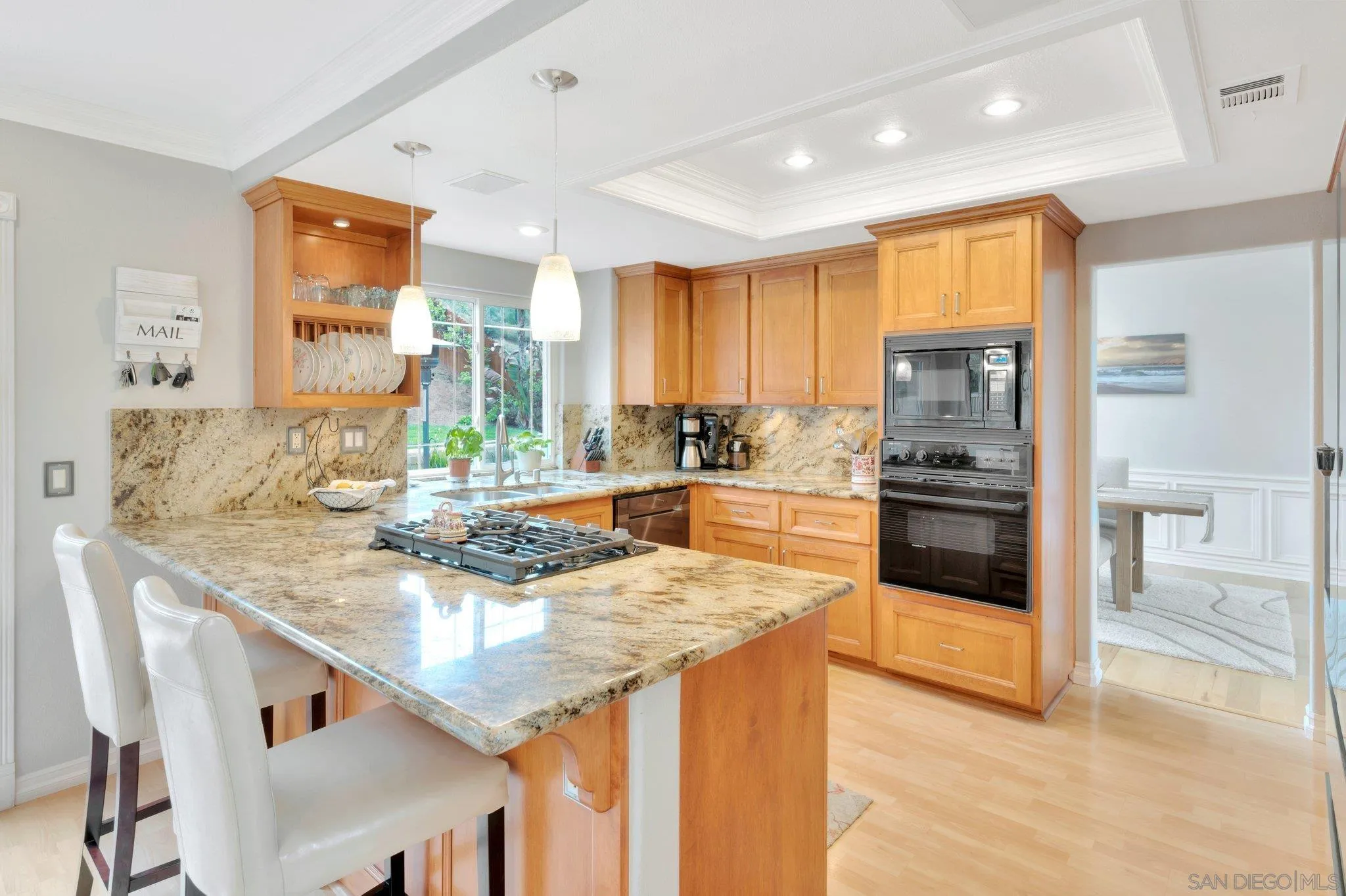 15095 Garden Road Poway, CA 92064 - Photo 10 of 55 a kitchen with granite countertop stainless steel appliances and wooden cabinets