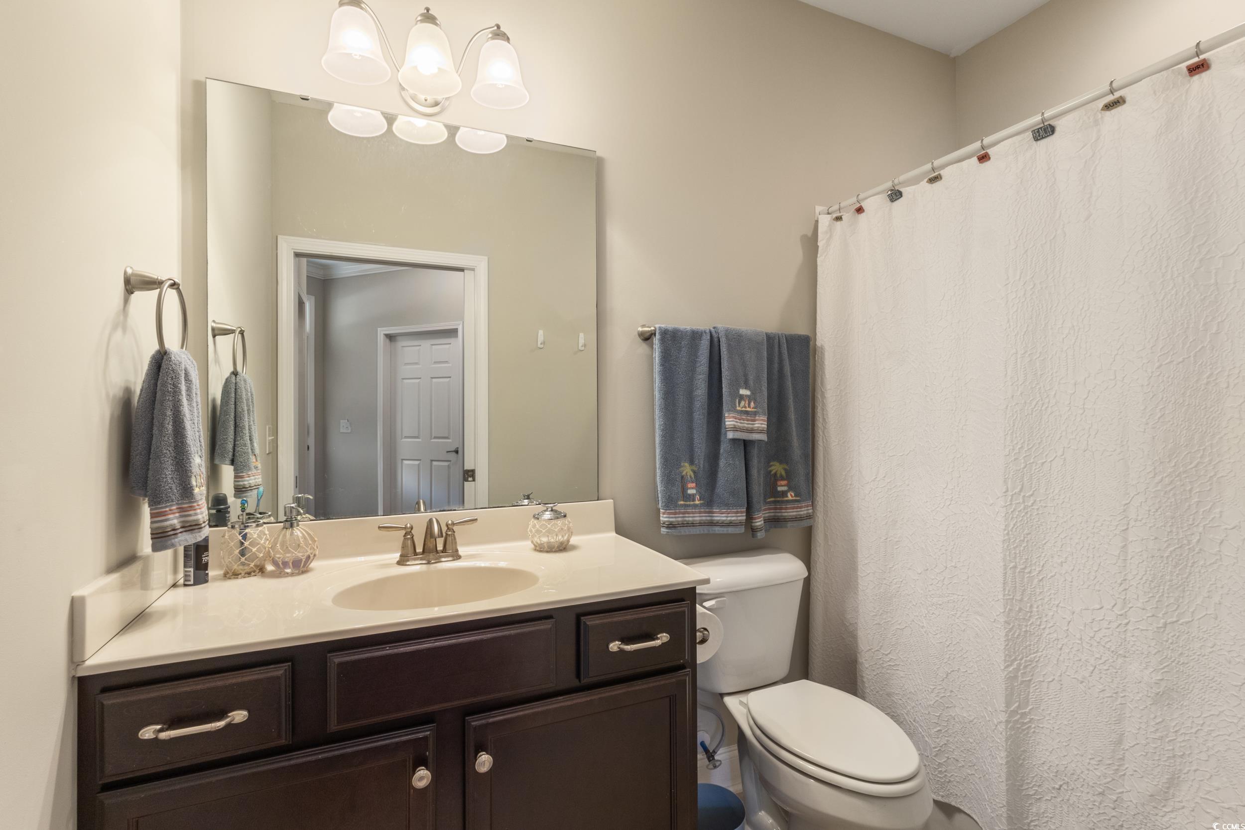 482 Botany Loop, Unit 155 Murrells Inlet, SC 29576 - Photo 10 of 40 Bathroom featuring vanity and a shower with shower curtain