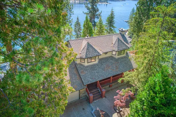 an aerial view of a house with outdoor space and street view