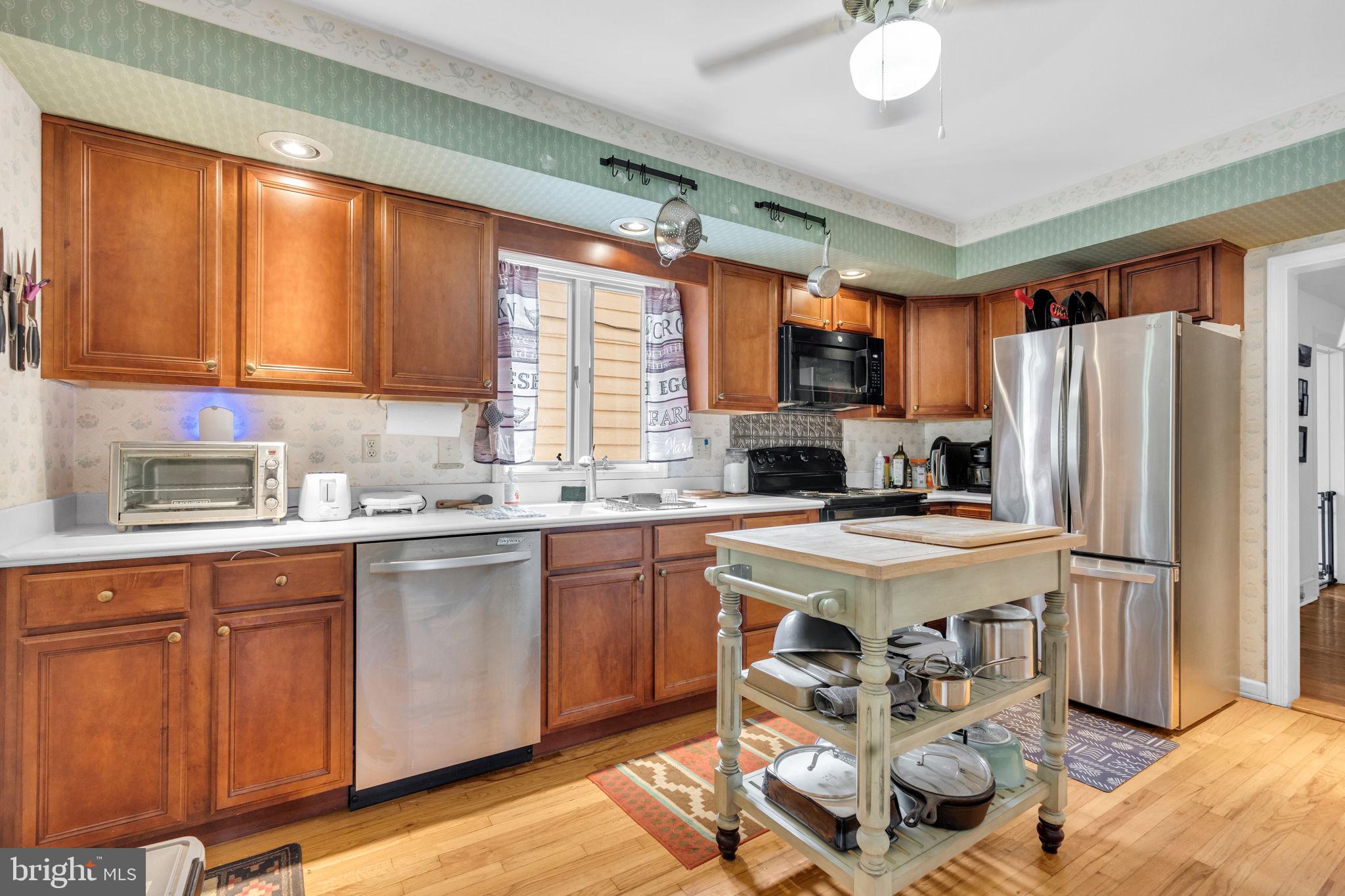 2072 Senseny Road Berryville, VA 22611 - Photo 13 of 63 Kitchen with Food Table in Middle of Room.