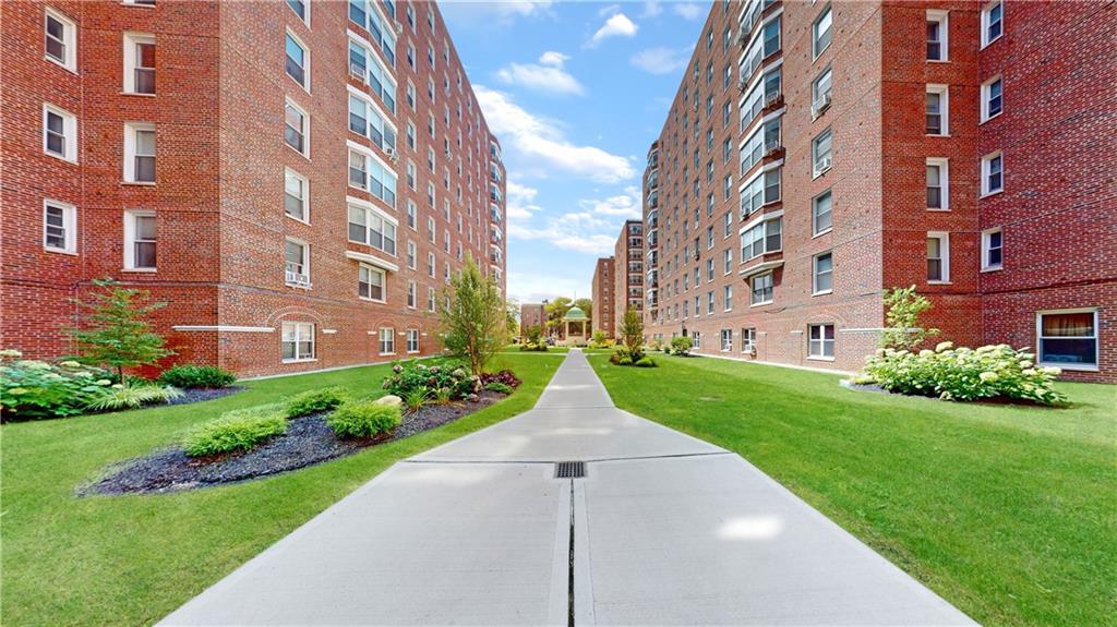 191 73rd Street, Unit 296 Brooklyn, NY 11209 - Photo 15 of 20 a view of a brick building next to a yard