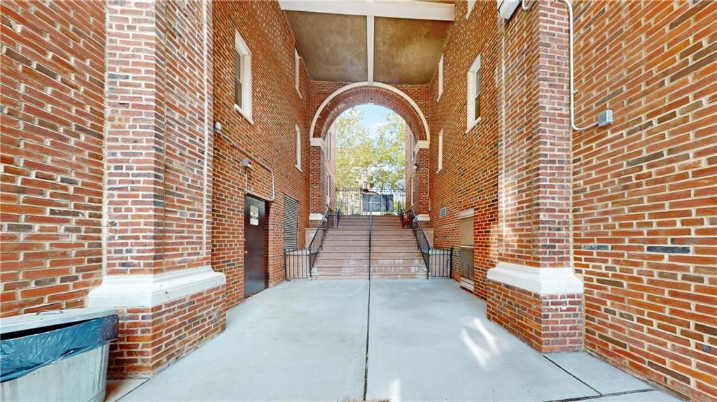 191 73rd Street, Unit 296 Brooklyn, NY 11209 - Photo 16 of 20 a view of a brick house with a pathway