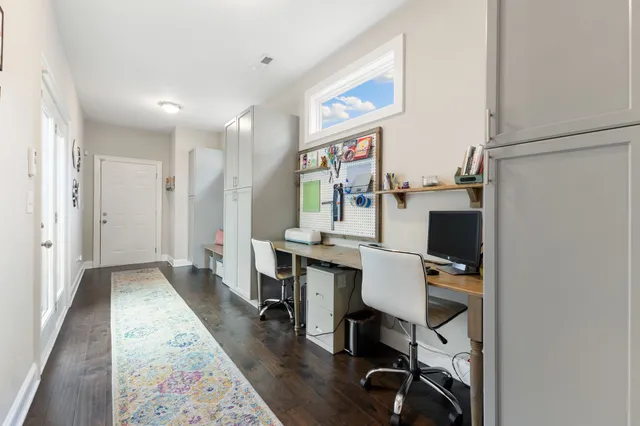a hallway with furniture and wooden floor