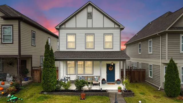 a front view of a house with garden
