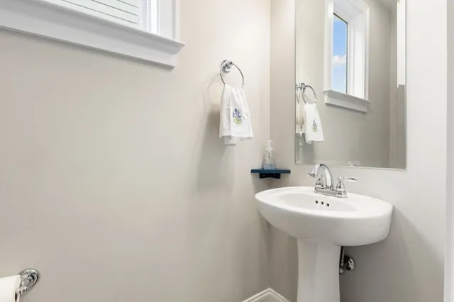 a bed room with a bed window and a flat screen tv