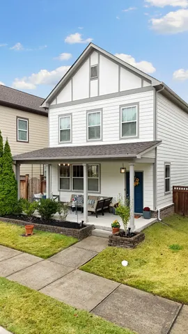 a view of a building with car parked in front of it