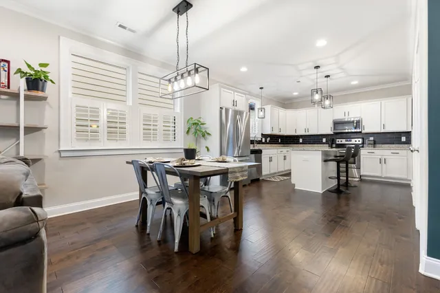 a view of a dining room with furniture and window
