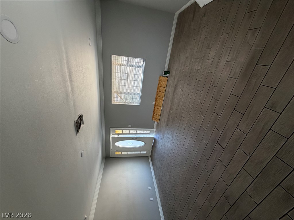 2820 South Sandhill Road, Unit A Las Vegas, NV 89121 - Photo 6 of 26 Elegant tile flooring in an inviting entryway with high ceilings.