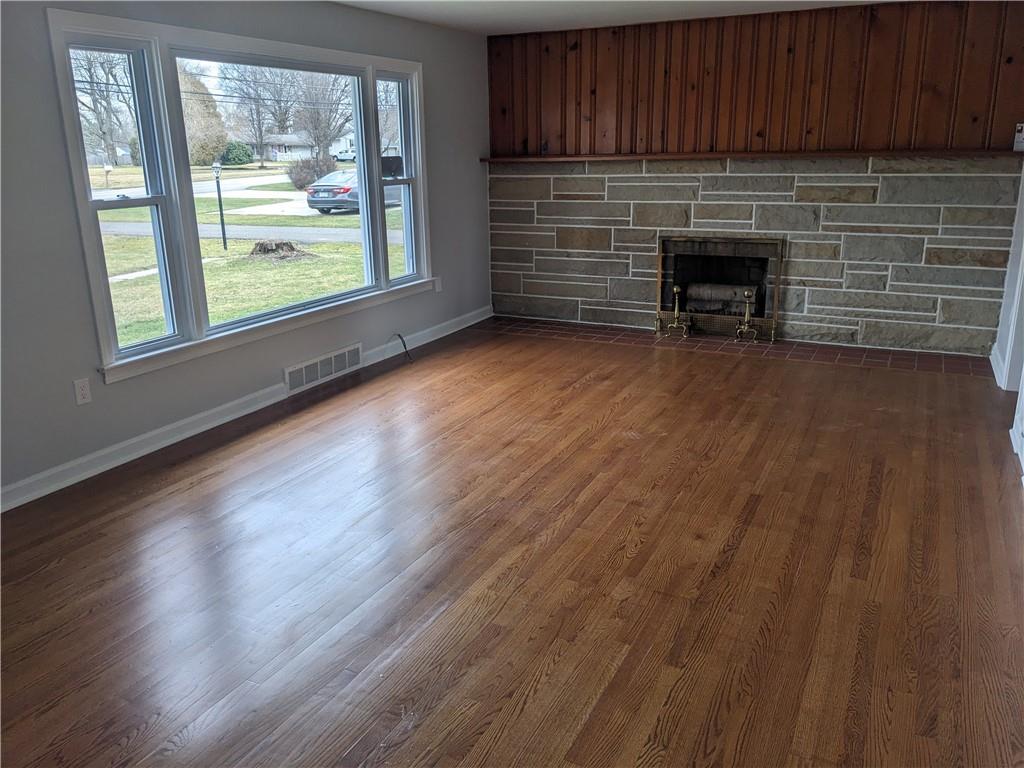 777 Blackhawk Road Beaver Falls, PA 15010 - Photo 7 of 20 Spacious Living room with gleaming hardwood floors, lots of light and fireplace.