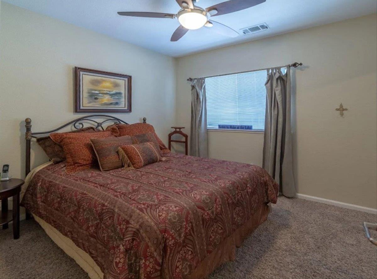 411 Sunrise Road Copperopolis, CA 95228 - Photo 47 of 76 Guest bedroom # 3 features a closet and ceiling fan as well.