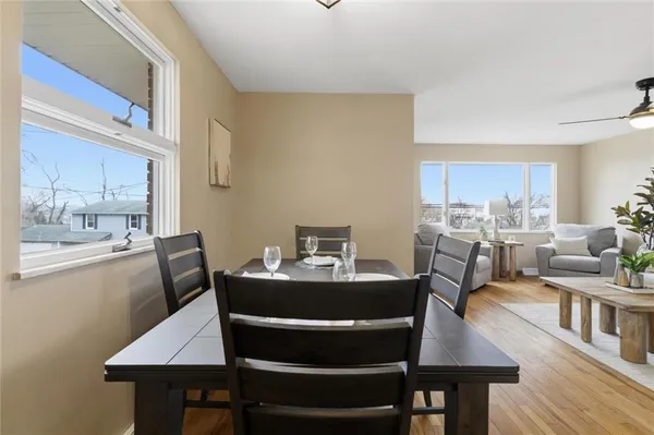 a view of a dining room with furniture and wooden floor