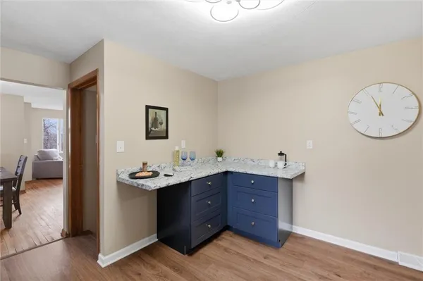 a bathroom with a sink vanity and a mirror
