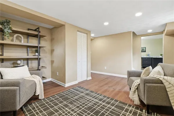 a bedroom with a bed and a couch