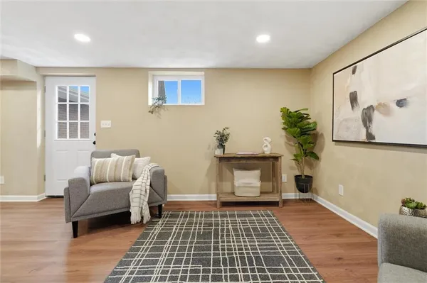a living room with furniture and a rug