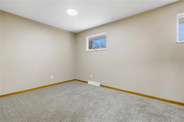 an empty room with a empty space and a window