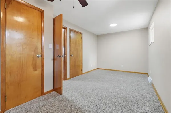 a bathroom with a sink mirror and toilet