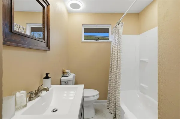 a bed room with a bed and a window