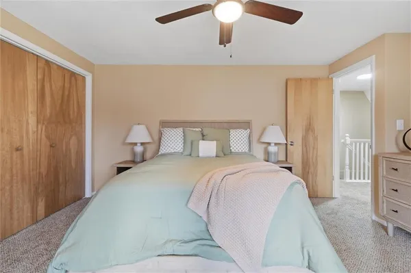 a bedroom with a bed and window