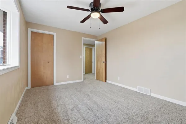 a bathroom with a toilet and a bathtub