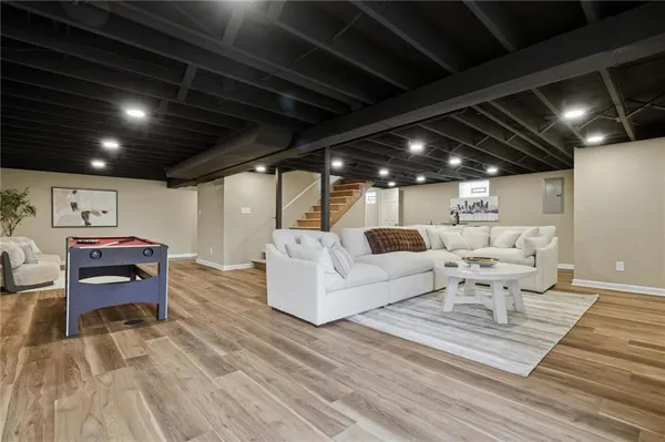 a spacious bedroom with two beds and painted walls