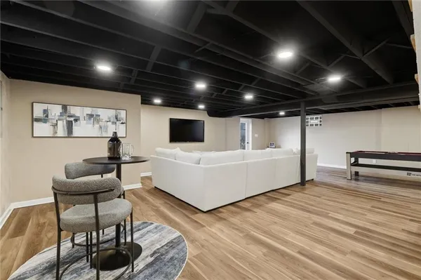 a bathroom with a toilet a sink and a mirror