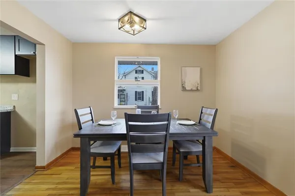 a view of a dining room with furniture and wooden floor