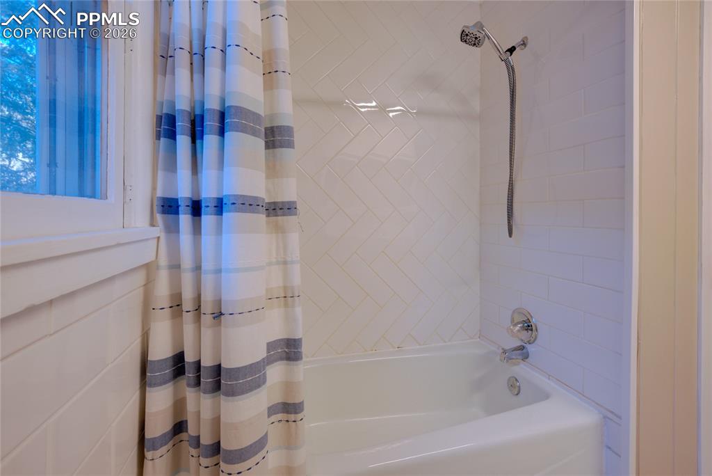 5835 Carnia Road Cascade, CO 80809 - Photo 20 of 31 a bathroom with a bathtub and shower