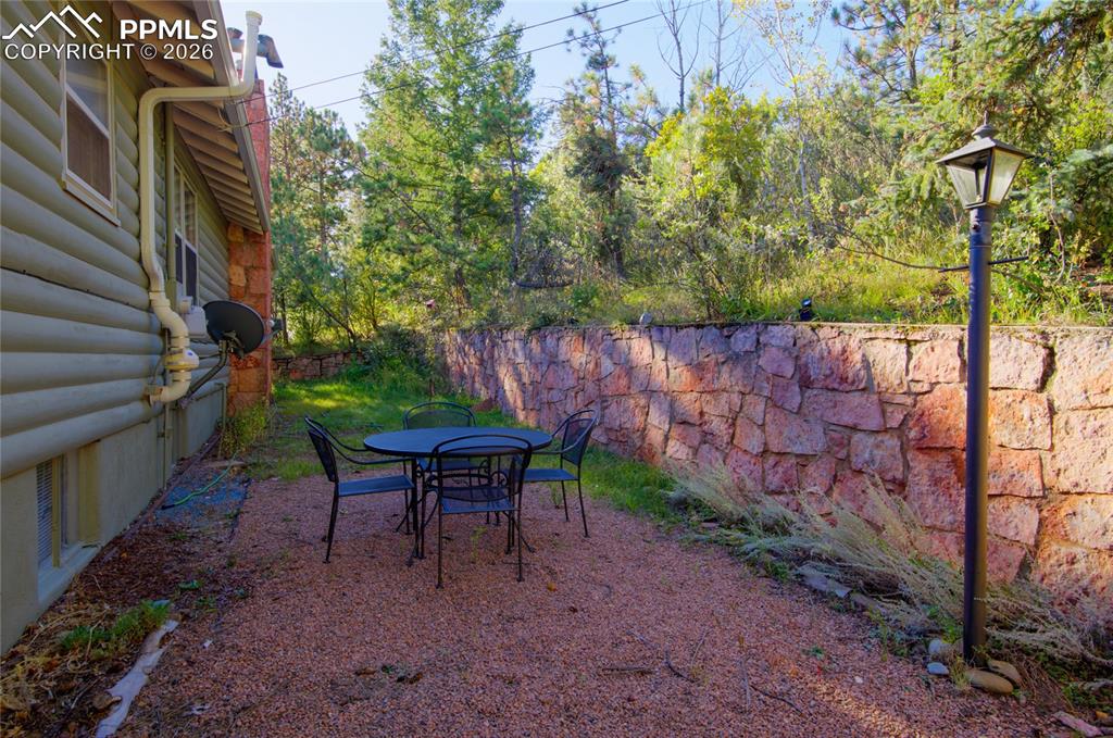 5835 Carnia Road Cascade, CO 80809 - Photo 29 of 31 a backyard of a house with lots of green space