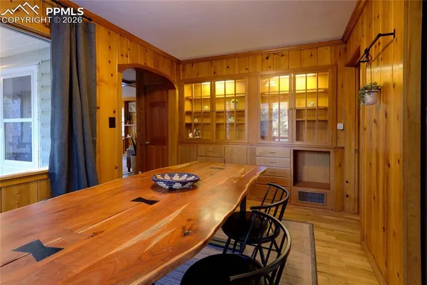 a bedroom with a bed and a table