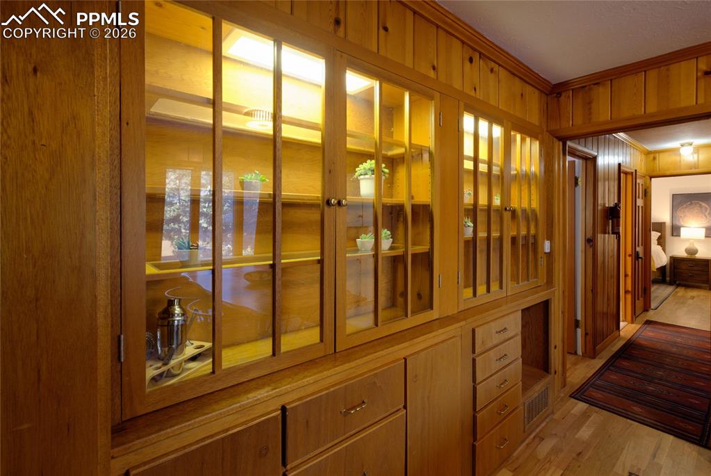 5835 Carnia Road Cascade, CO 80809 - Photo 10 of 31 a view of a hallway with wooden floor and windows