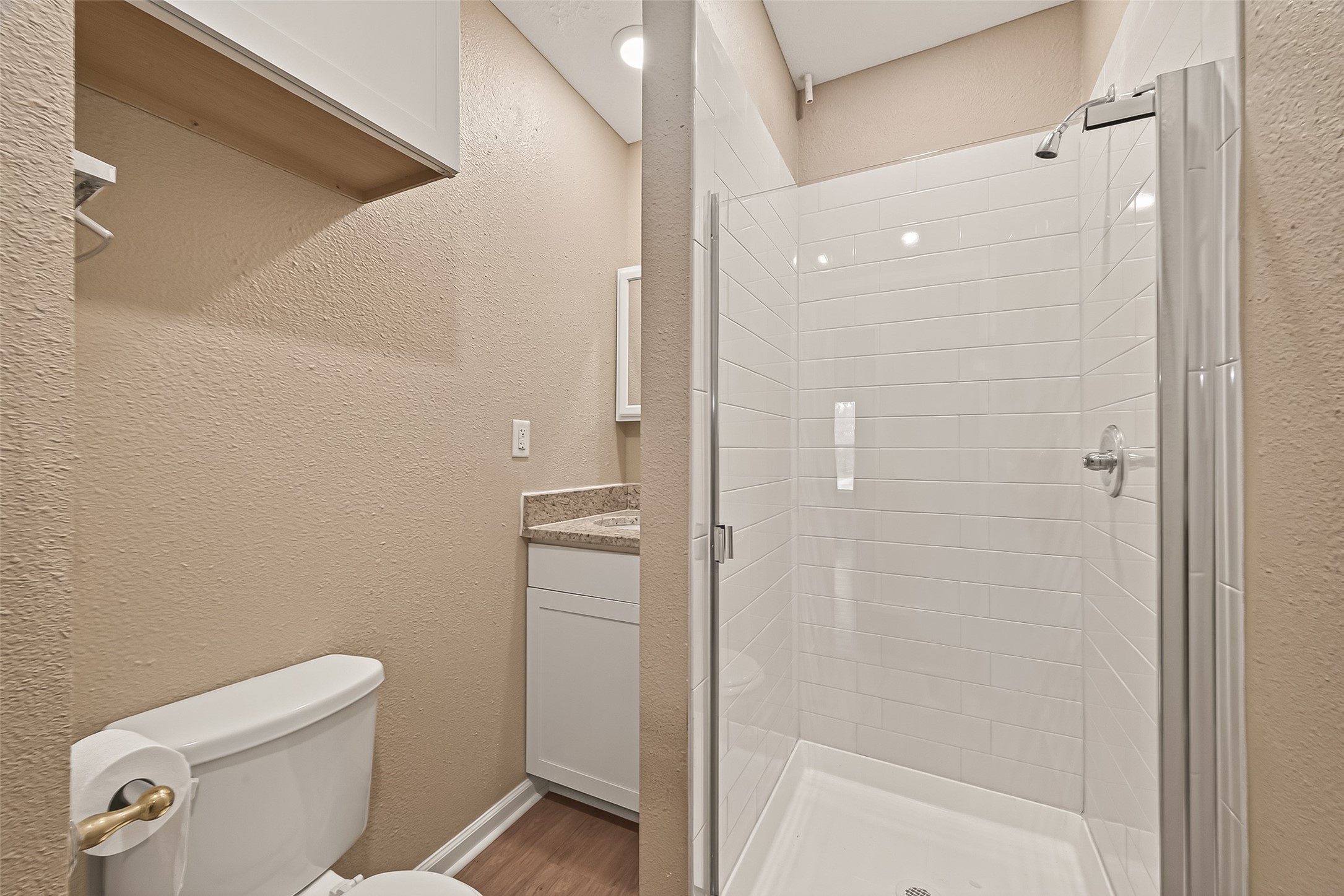1402 Munger Street Houston, TX 77023 - Photo 18 of 22 a bathroom with a shower a toilet and sink