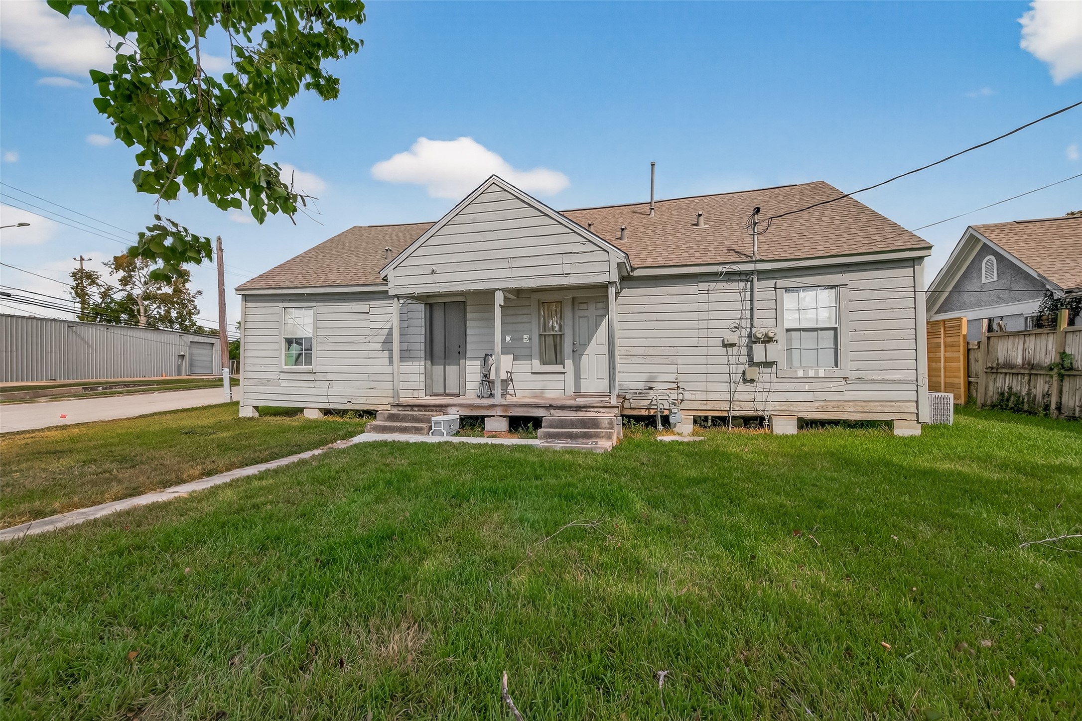 1402 Munger Street Houston, TX 77023 - Photo 21 of 22 a front view of a house with a yard patio and fire pit
