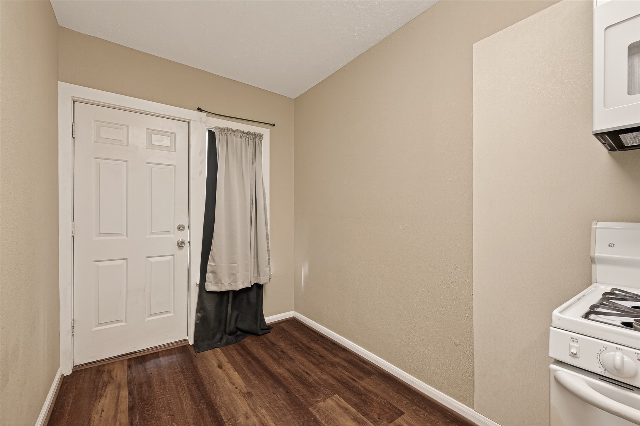 1402 Munger Street Houston, TX 77023 - Photo 9 of 22 a view of an entryway with wooden floor