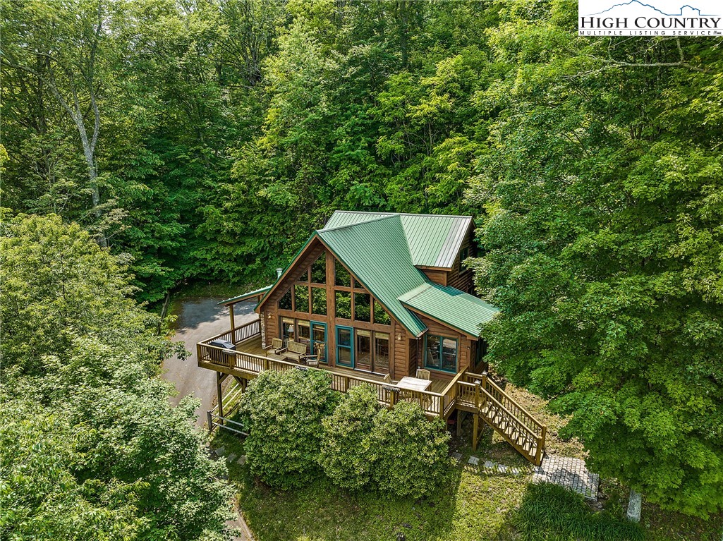 320 Timber Ridge Road Sugar Mountain, NC 28604 - Photo 2 of 30 a house with trees in the background