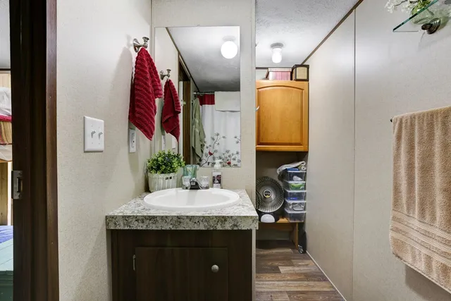 a bedroom with a bed and a walk in closet